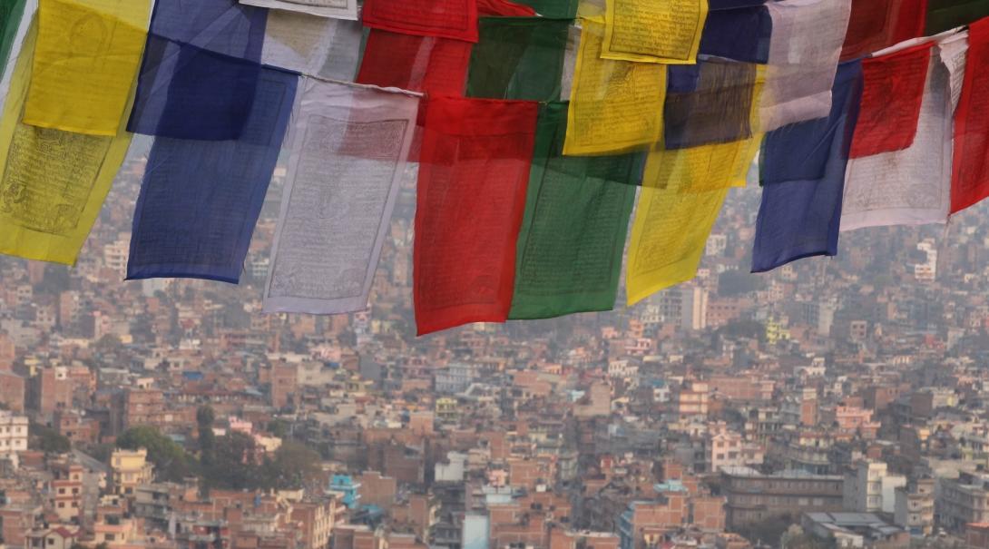 HIV/AIDS volunteers working in Nepal look at prayer flags. Projects Abroad HIV/AIDS volunteers in Nepal travel over the weekends and take a photo of prayer flags.